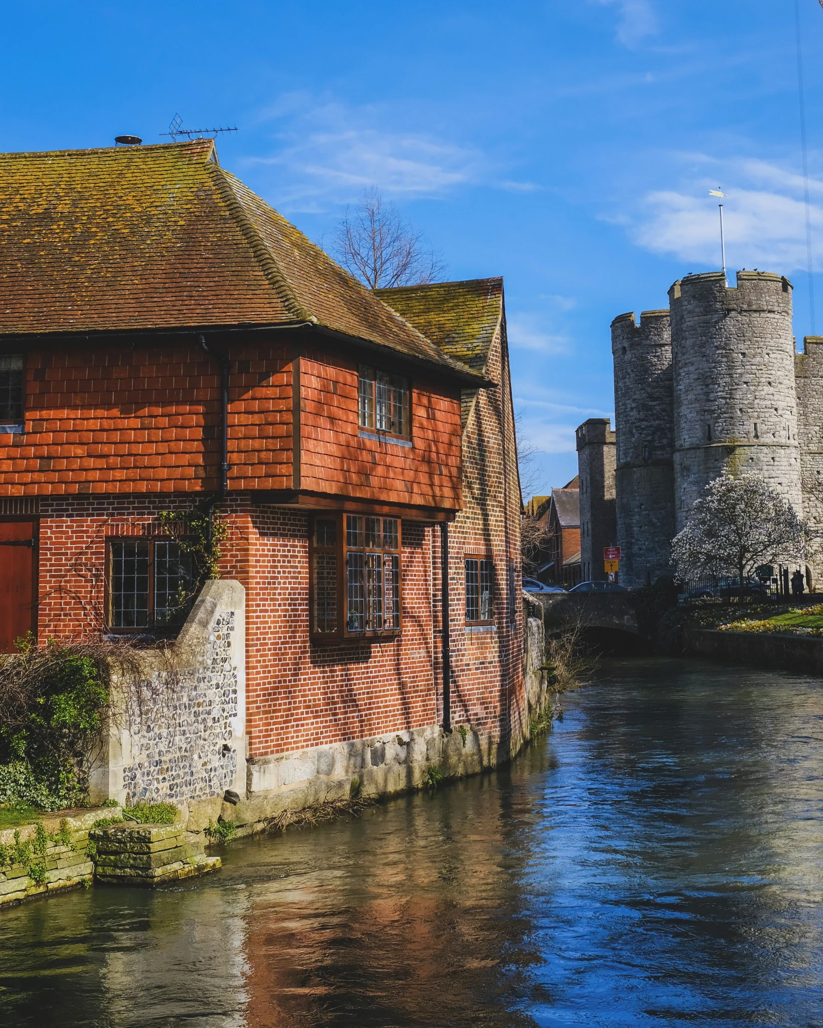 Historic waterside buildings beside a river